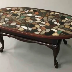 Oval coffee table with multi coloured cut rock