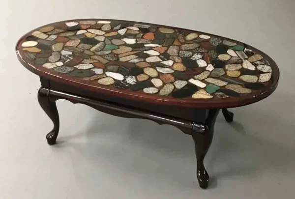 Oval coffee table with multi coloured cut rock