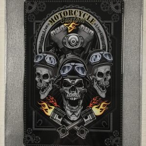 Metal art piece of skulls with silver framing